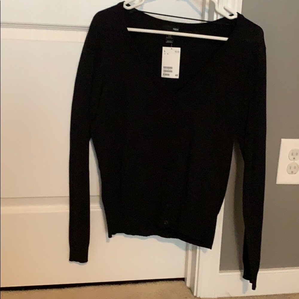 Black cardigan. Never worn.